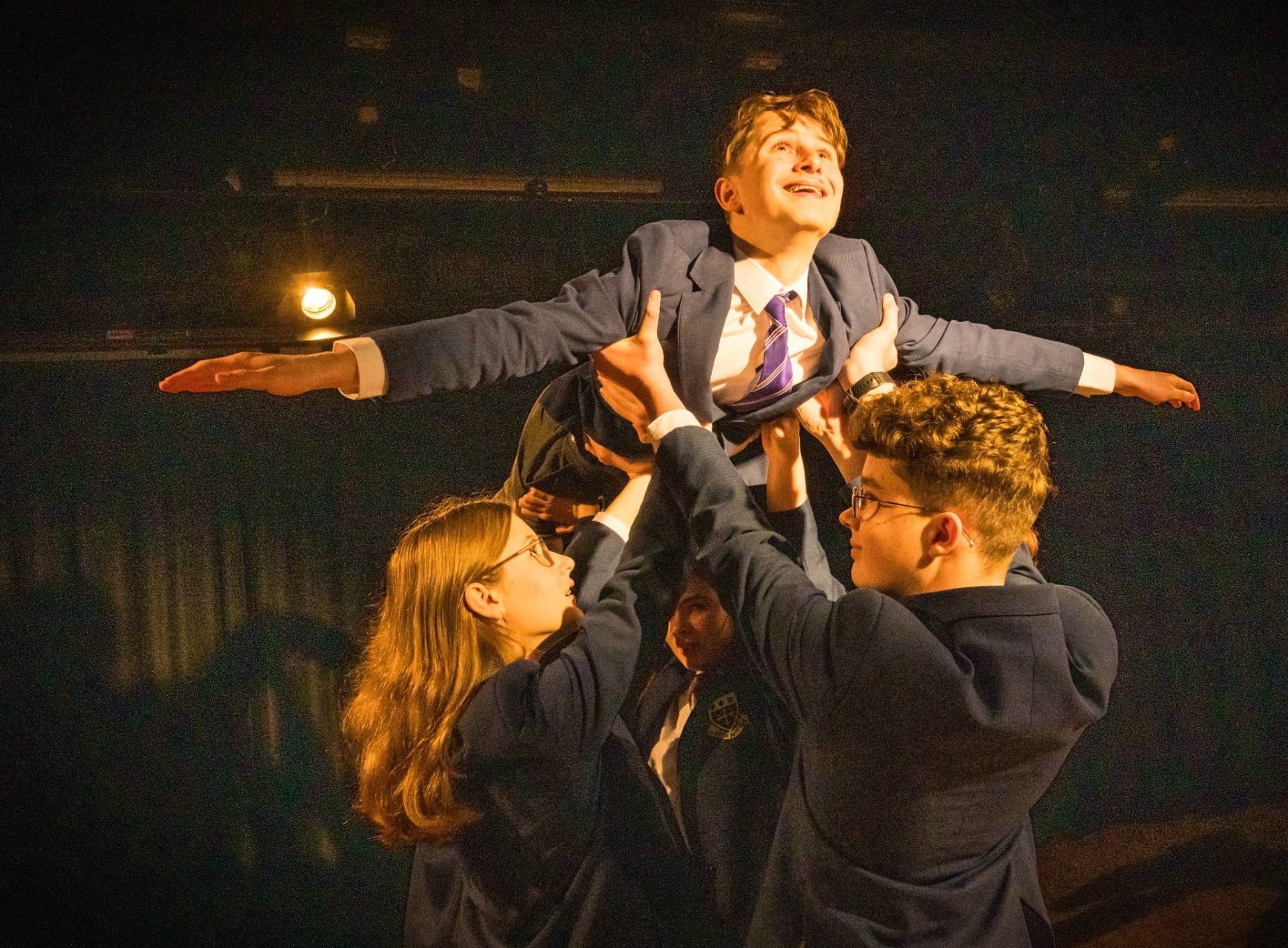 Pupils performing on stage